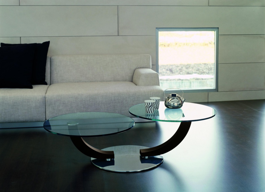 A coffee table on a steel base with glass top Cobra inox, Cattelan Italia