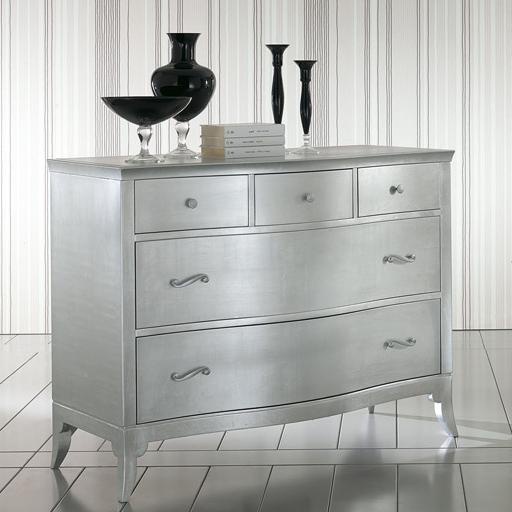 A chest of drawers with curved facade at the stilema stand