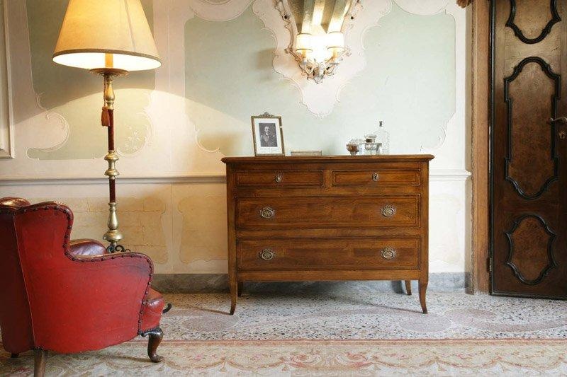 A chest of drawers on high legs, the Ca' d'oro