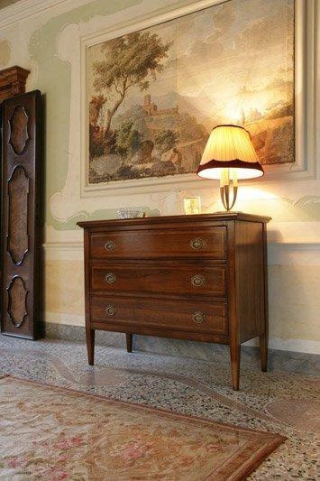 A chest of drawers on high legs, the Ca' d'oro
