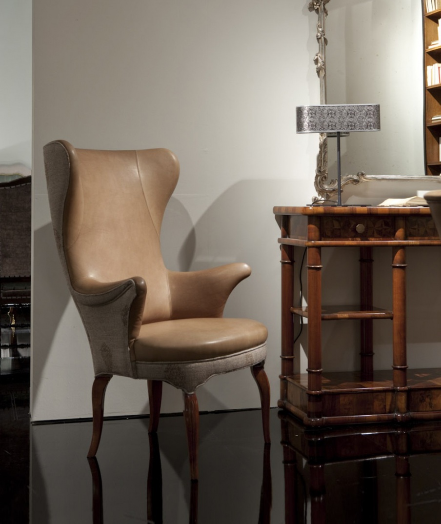 Chair with legs is made of solid cherry and upholstered in leather and fabric, Annibale Colombo 