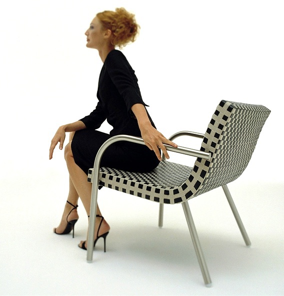 Armchair with wooden frame entwined with ribbons of leather and linen Opera, Bonacina Pierantonio