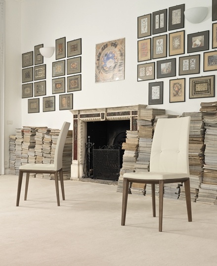A chair on a frame of solid walnut or beech wood upholstered in leather, Coco, Bonaldo