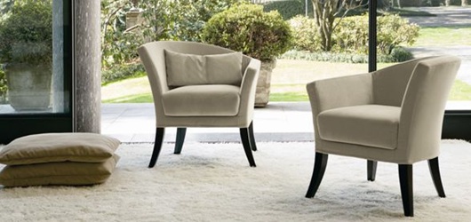 An armchair with asymmetrical backrest, Rosita Swan