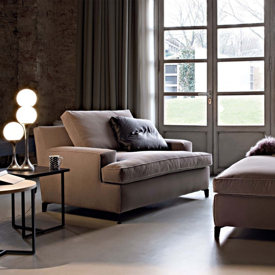 A chair made from wood, filled with polyurethane foam and upholstered in textile fabrics Malta, Arketipo