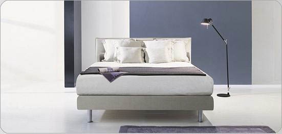 A bed on a wooden frame upholstered in fabric Paco, Bonaldo