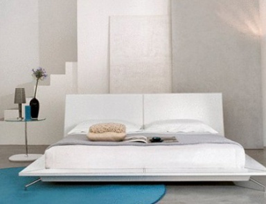 Double bed with a podium with metal legs upholstered leather Sailor, Bonaldo