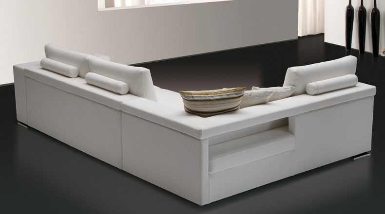 Sofa sectional upholstered in leather or fabric with an integrated shelf, Flap, Bodema