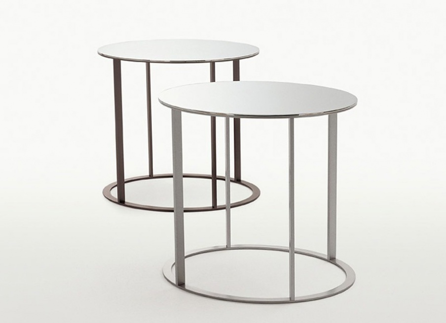 A coffee table on a frame of chrome-plated steel with a table top of glass Elios, B&B Italia