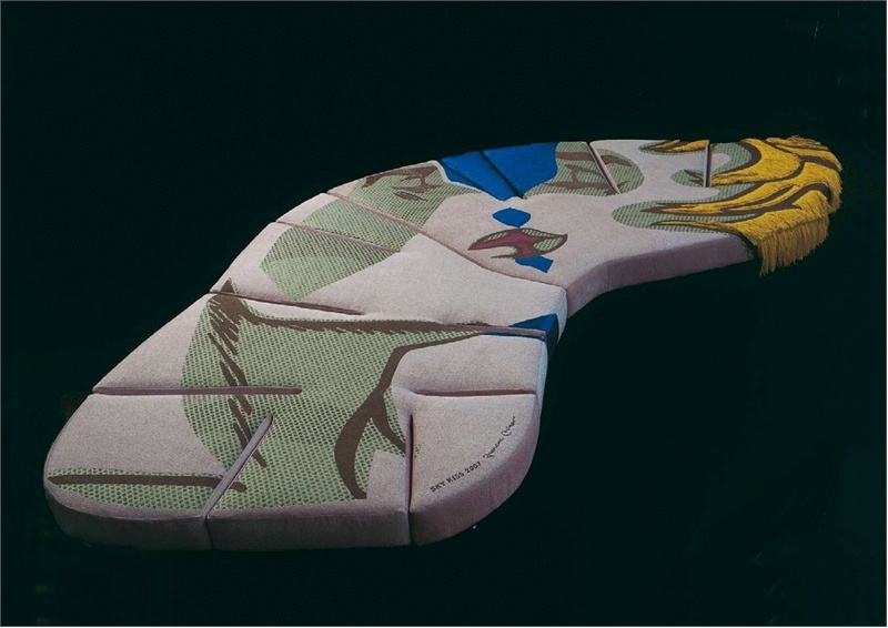 A sofa covered with a cloth Flap, Edra