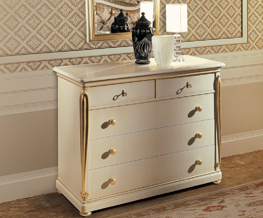 A chest of drawers with gold detail Copland, Angelo Cappellini