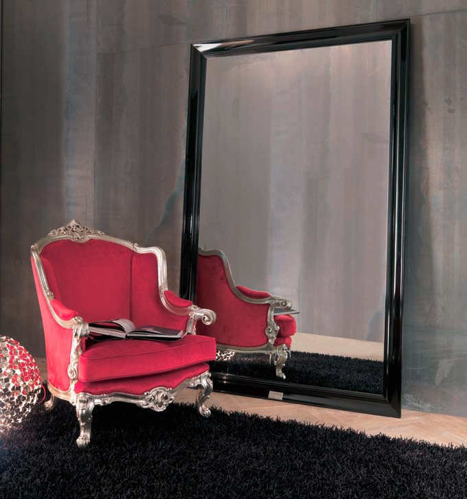 A chair with a high back Carved armchair, Bizzotto