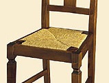 The chair has a carved DOLFI