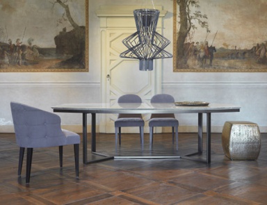 The chair is upholstered in Charlotte, Giulio Marelli