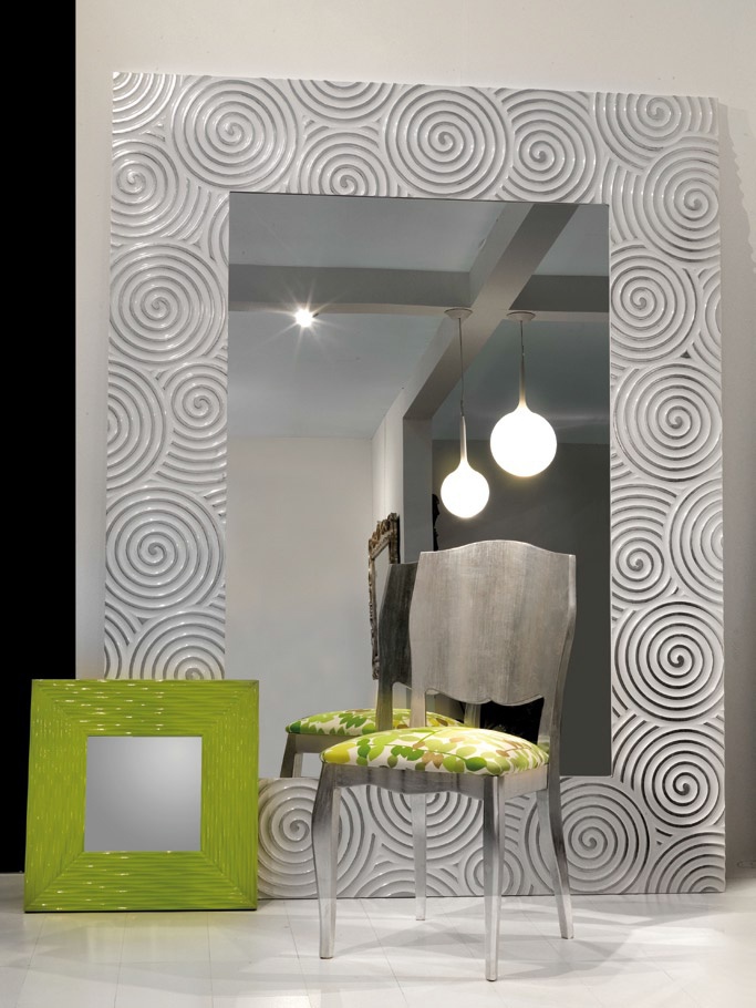A mirror in a frame decorated with concentric circles, Spini