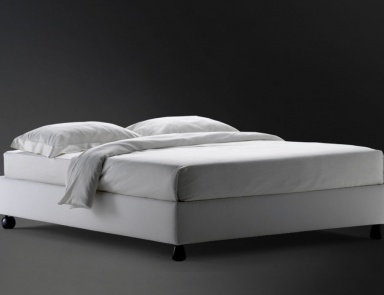Bed upholstered in leather or fabric Sommier, Flou