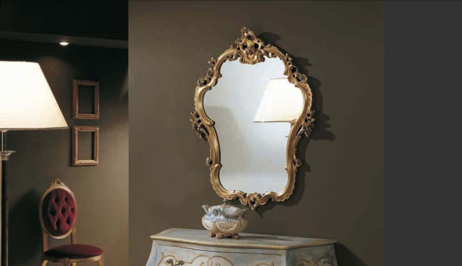 A mirror with a through thread in the gold finish 700, Arve Style