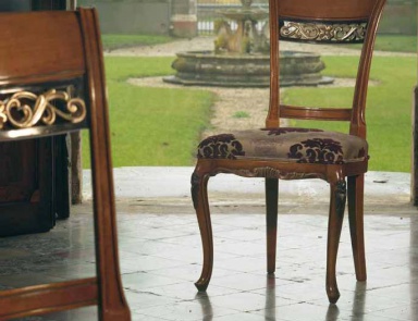 The chair in the walnut finish with gold Villa, Arve Style