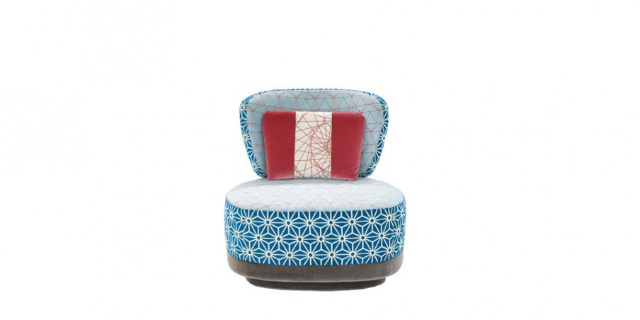 The Juju armchair is upholstered in fabric, Moroso