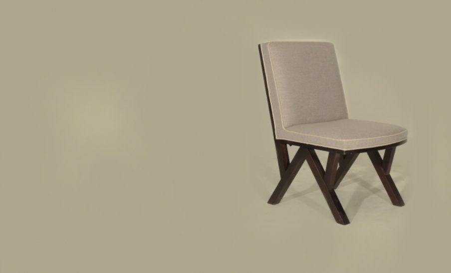 The chair is upholstered in natural wool, Chelini