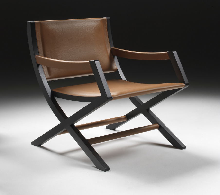 The chair frame is made of solid wood upholstered in leather, Emily Flexform