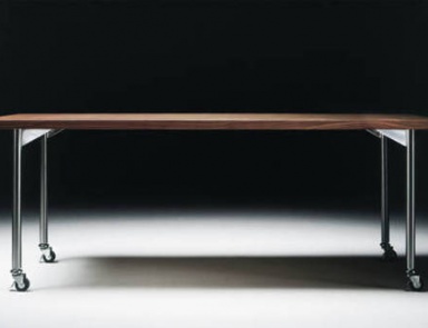 A table made of wood and metal on castors Mixer, Flexform