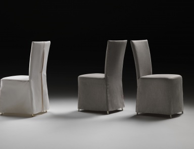 A chair with a high back on a metal frame Eva Flexform