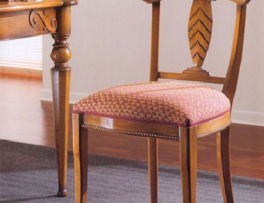 A chair with soft upholstery, PREGNO